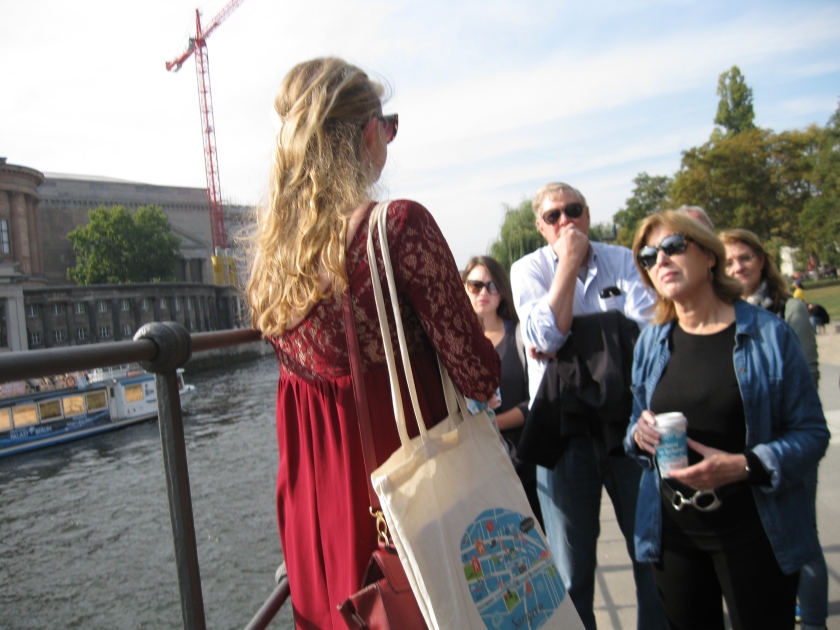 Our tour guide gives us Berlin history lesson as we stand over the river Spree.