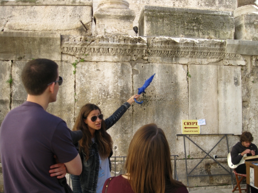 Lucy, the guide for our walking tour, is a Split native. If you look up above where she's pointing, you can see a Roman cross on one of the sarcophagi.